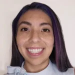 Hispanic woman with long straight hair smiling.